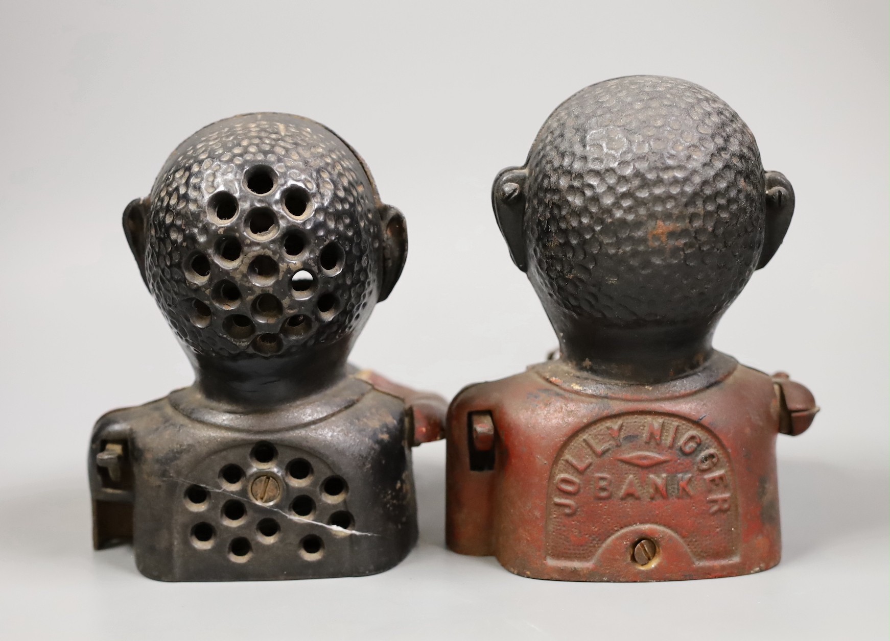 Two vintage cast iron money banks, 19cm tall